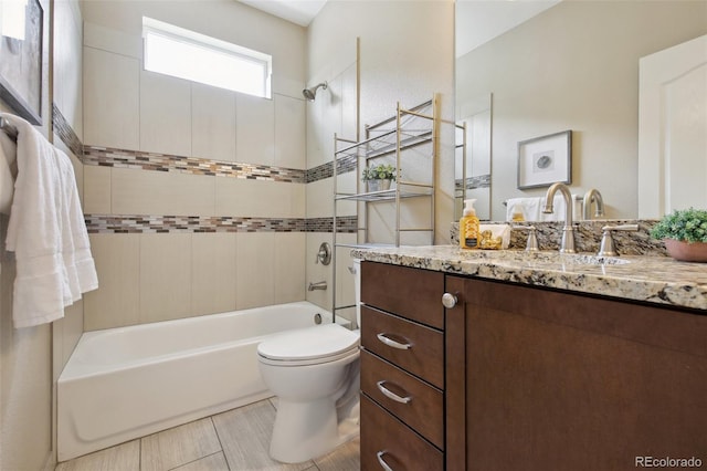 1235 S Balsam St, Lakewood, CO 80232 - bathroom with vanity, washtub / shower combination, and toilet