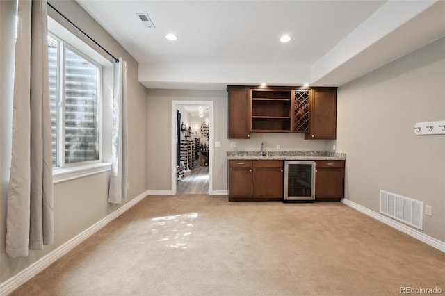 1235 S Balsam St, Lakewood, CO 80232 - indoor wet bar featuring wine cooler, light colored carpet, baseboards, and recessed lighting