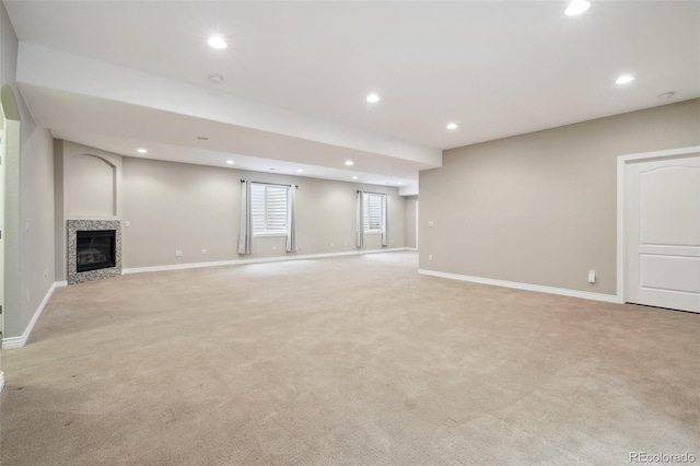 1235 S Balsam St, Lakewood, CO 80232 - below grade area featuring light carpet, recessed lighting, baseboards, and a premium fireplace