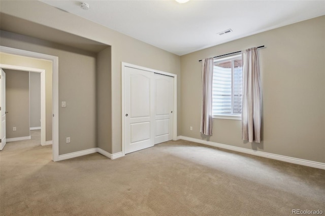 1235 S Balsam St, Lakewood, CO 80232 - unfurnished bedroom featuring light colored carpet, a closet, and baseboards