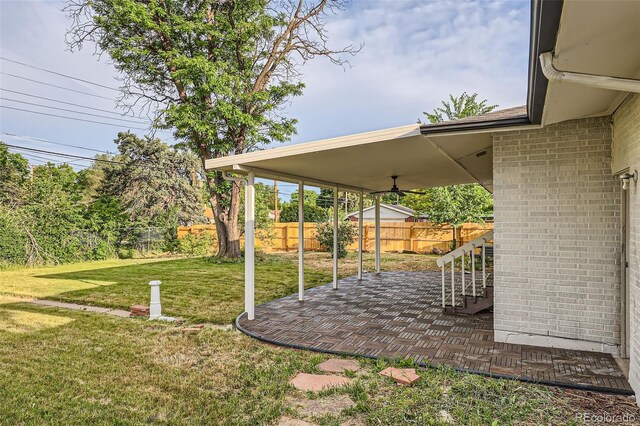 2996 S Sheridan Blvd, Denver, CO 80227 - fenced backyard featuring a patio