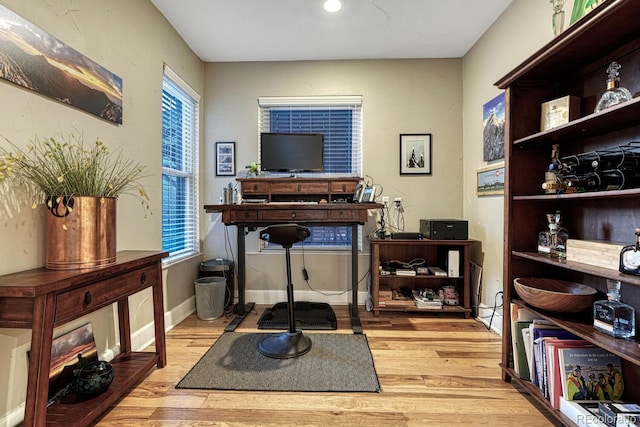 office space with light wood finished floors
