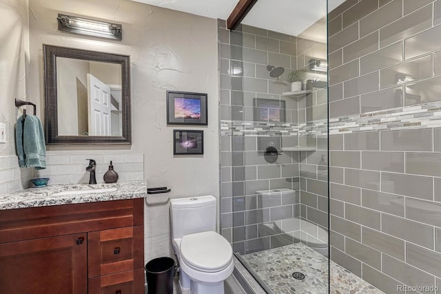 full bath with walk in shower, vanity, and toilet