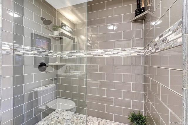 full bathroom with a tile shower