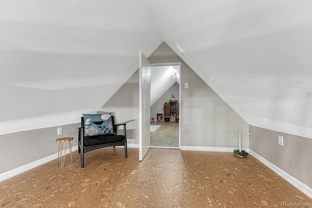 bonus room featuring vaulted ceiling