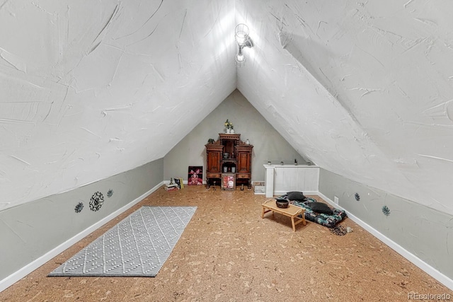 bonus room featuring lofted ceiling