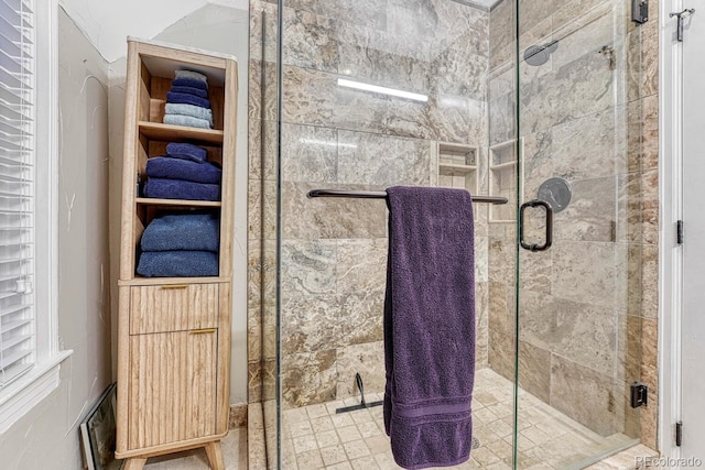 bathroom with a shower stall