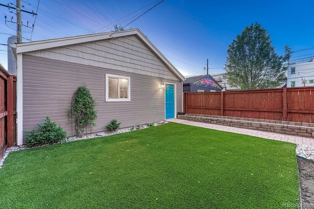 view of yard with a fenced backyard