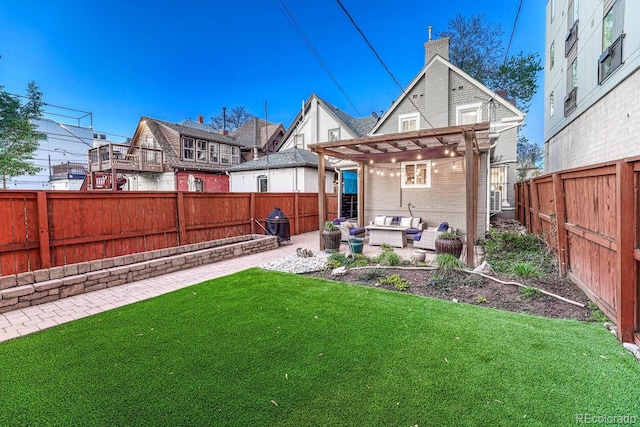 back of property with a pergola, an outdoor living space, a fenced backyard, a yard, and a patio area