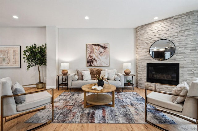 467 Harrison St, Denver, CO 80206 - living area with a fireplace, recessed lighting, and wood finished floors