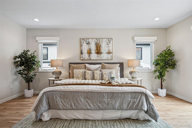 467 Harrison St, Denver, CO 80206 - bedroom with multiple windows, wood finished floors, and recessed lighting