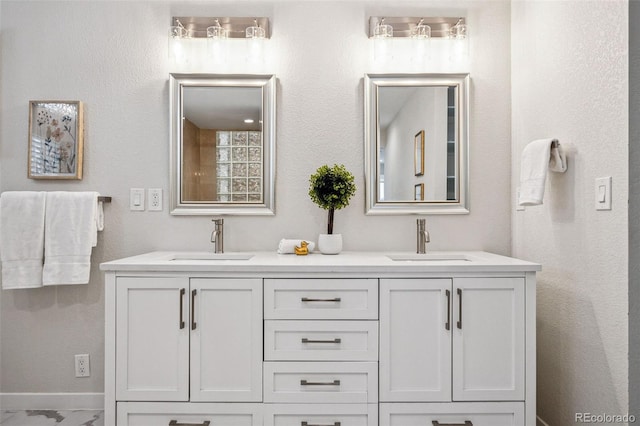 467 Harrison St, Denver, CO 80206 - full bathroom featuring double vanity and marble finish flooring