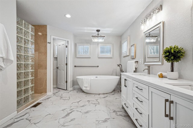 467 Harrison St, Denver, CO 80206 - full bath with walk in shower, a freestanding bath, double vanity, marble look tile flooring, and a chandelier