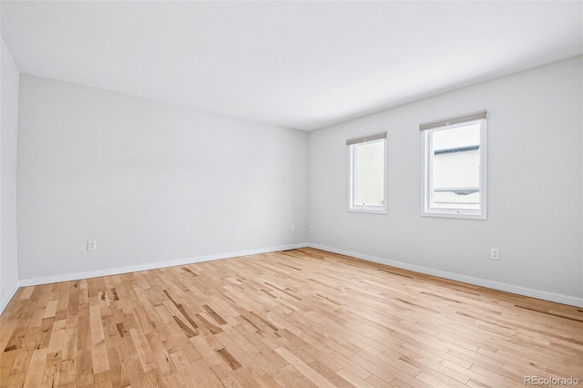 467 Harrison St, Denver, CO 80206 - unfurnished room with wood finished floors and baseboards