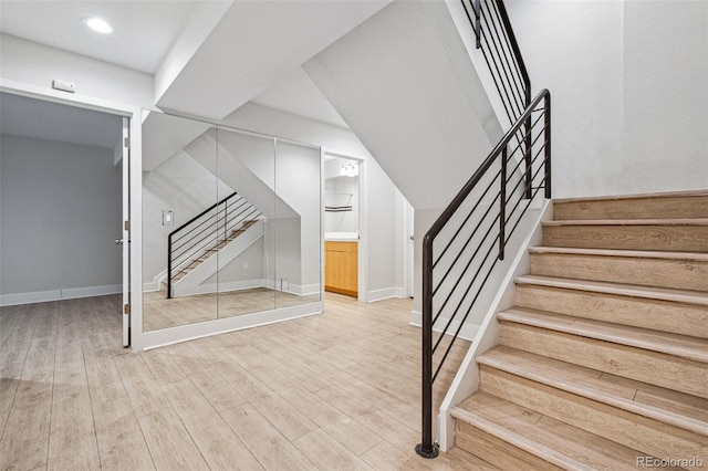 467 Harrison St, Denver, CO 80206 - stairway with wood finished floors and recessed lighting