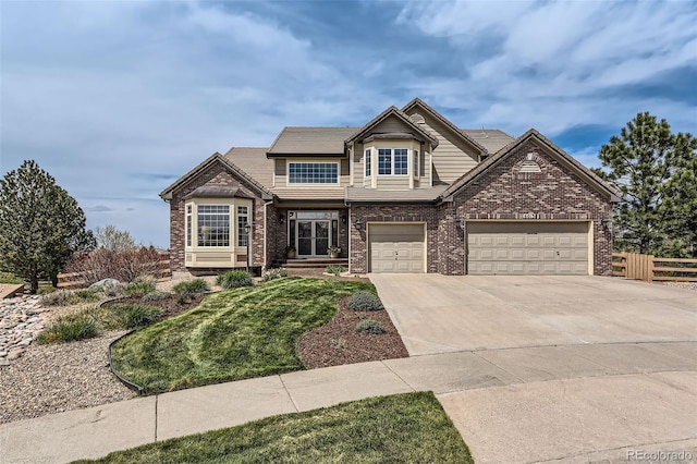 6013 S Kittredge Ct, Centennial, CO 80016 - craftsman house with fence, an attached garage, a front lawn, brick siding, and concrete driveway