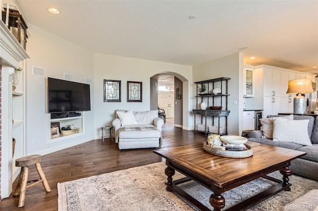 6013 S Kittredge Ct, Centennial, CO 80016 - living room featuring arched walkways, dark wood finished floors, recessed lighting, baseboards, and visible vents