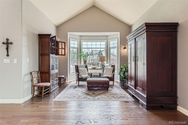 6013 S Kittredge Ct, Centennial, CO 80016 - sitting room featuring baseboards, vaulted ceiling, and wood finished floors