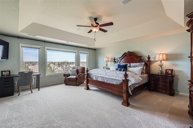 6013 S Kittredge Ct, Centennial, CO 80016 - bedroom with a tray ceiling, light colored carpet, baseboards, and visible vents