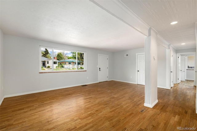 1406 N Foote Ave, Colorado Springs, CO 80909 - unfurnished living room with wood finished floors and recessed lighting