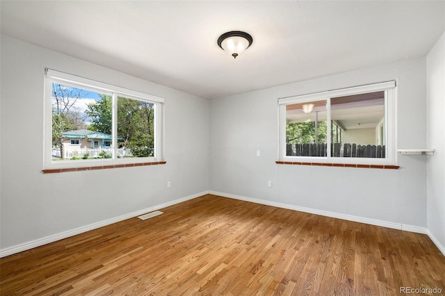 1406 N Foote Ave, Colorado Springs, CO 80909 - empty room with wood finished floors and baseboards