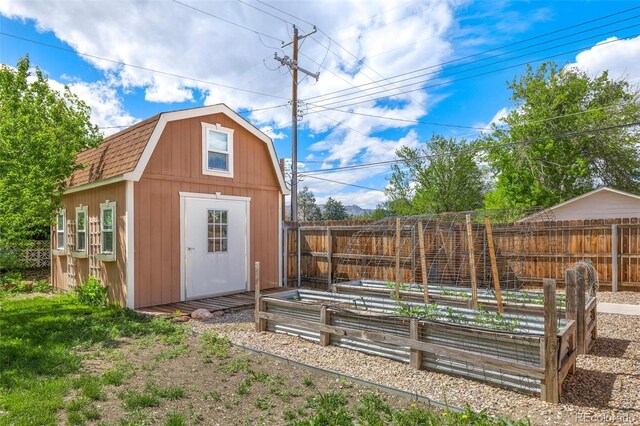 1406 N Foote Ave, Colorado Springs, CO 80909 - view of shed featuring a garden and a fenced backyard