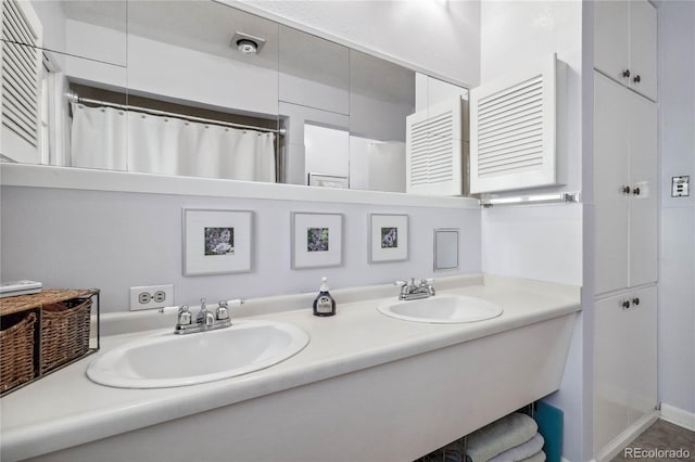 bathroom with vanity and curtained shower