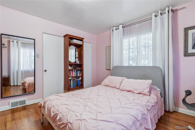 bedroom featuring hardwood / wood-style floors