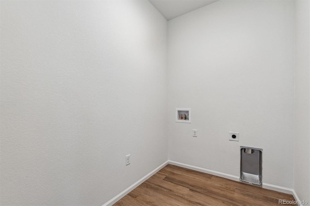 washroom featuring hardwood / wood-style floors, hookup for an electric dryer, and washer hookup