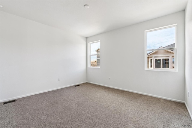 unfurnished room featuring carpet flooring