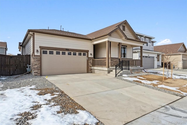 view of front of house featuring a porch and a garage