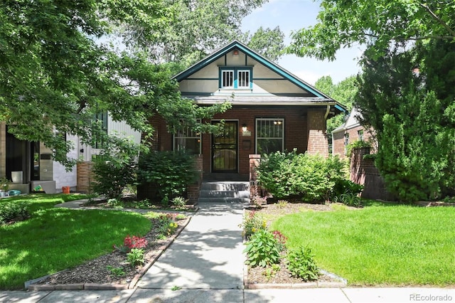 321 S Gilpin St, Denver, CO 80209 - view of front of property featuring a front yard and brick siding