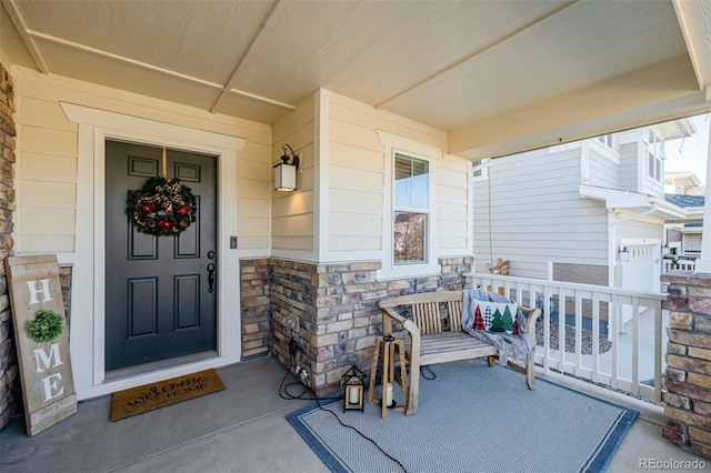 property entrance with covered porch