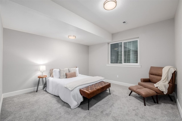 carpeted bedroom featuring baseboards and visible vents