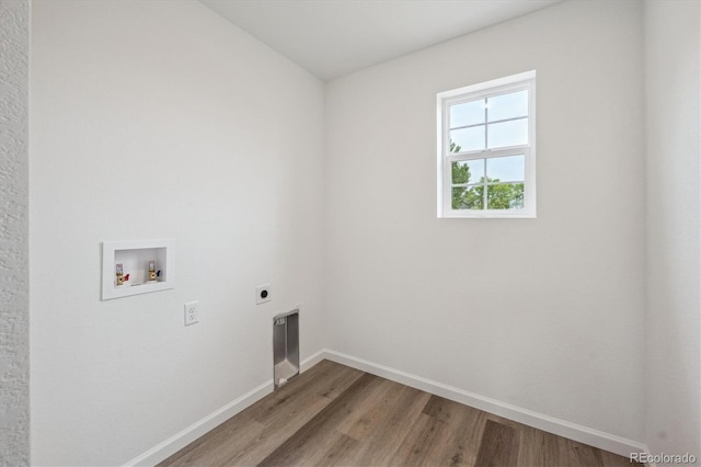 4246 Graywood Dr, Johnstown, CO 80534 - washroom featuring hookup for an electric dryer, washer hookup, light wood finished floors, and baseboards
