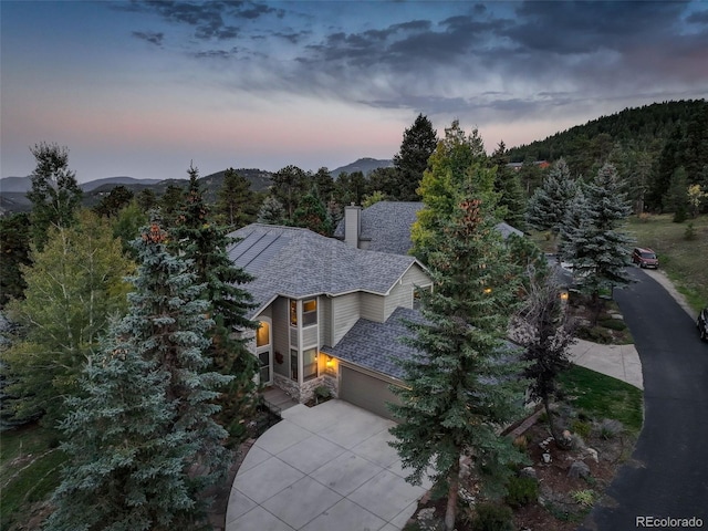 aerial view at dusk with a mountain view