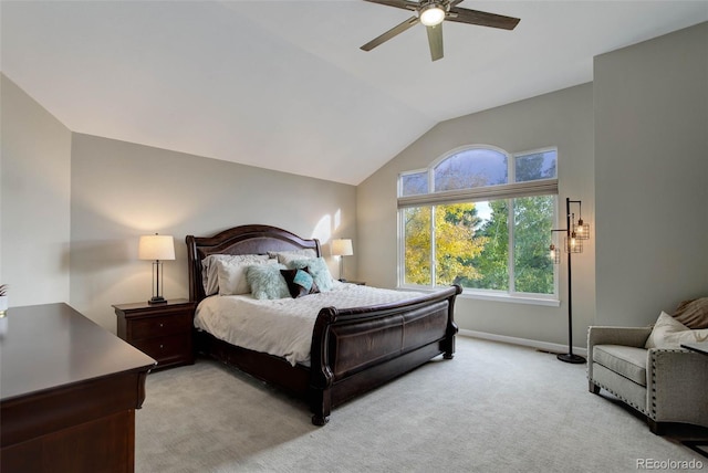 bedroom featuring vaulted ceiling, light carpet, and ceiling fan