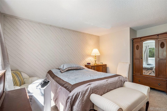 carpeted bedroom with a textured ceiling