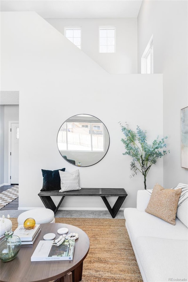 living room with a towering ceiling