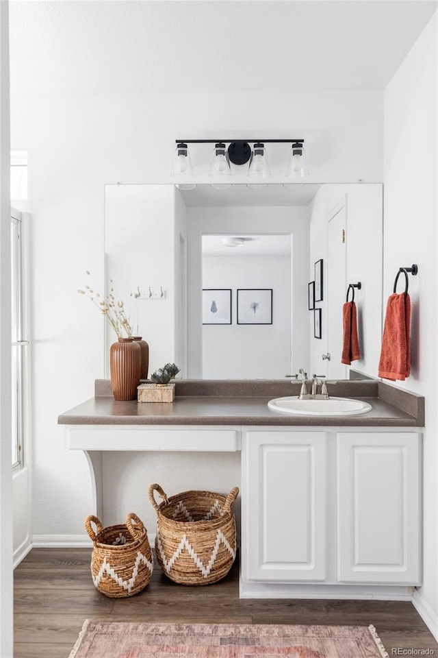 bathroom with vanity and wood-type flooring