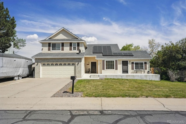 9908 Garfield Ct, Thornton, CO 80229 - traditional home featuring an attached garage, driveway, solar panels, a front lawn, and roof with shingles