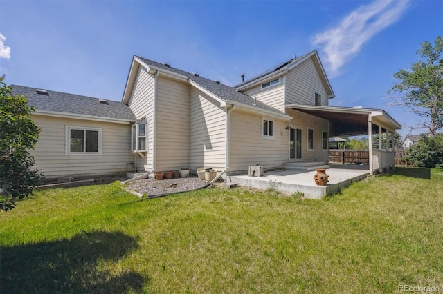 9908 Garfield Ct, Thornton, CO 80229 - rear view of house featuring a patio, a lawn, and roof with shingles