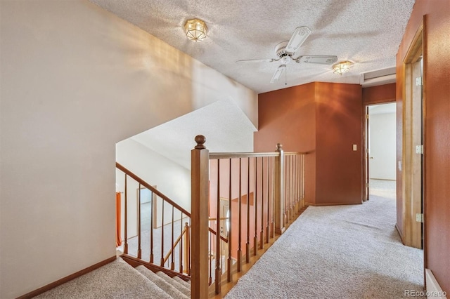9908 Garfield Ct, Thornton, CO 80229 - hall featuring carpet, baseboards, an upstairs landing, and a textured ceiling
