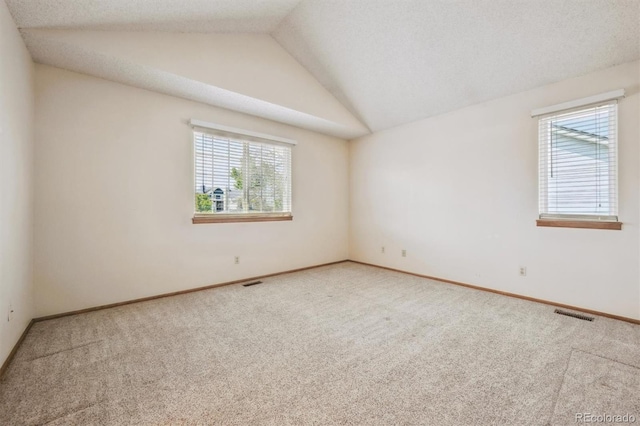 9908 Garfield Ct, Thornton, CO 80229 - empty room featuring carpet floors, vaulted ceiling, and baseboards