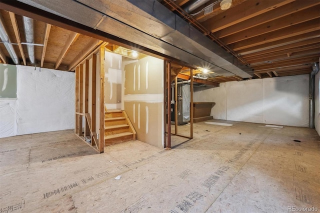 9908 Garfield Ct, Thornton, CO 80229 - unfinished basement featuring stairway and heating unit