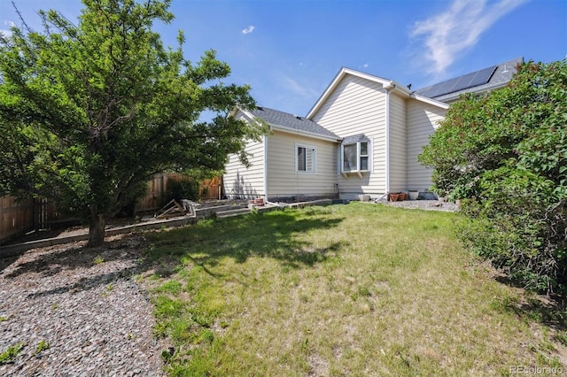 9908 Garfield Ct, Thornton, CO 80229 - back of house featuring a vegetable garden