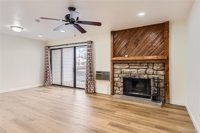 unfurnished living room featuring wood finished floors, a fireplace, recessed lighting, and ceiling fan