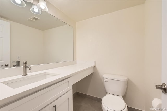 bathroom featuring visible vents, toilet, baseboards, and vanity