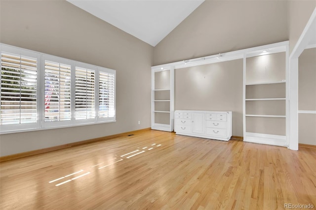 5622 E Weaver Cir, Centennial, CO 80111 - spare room with wood finished floors, high vaulted ceiling, and baseboards