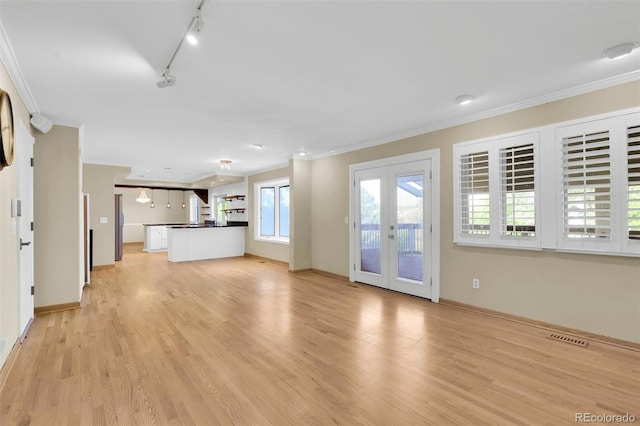 5622 E Weaver Cir, Centennial, CO 80111 - unfurnished living room featuring ornamental molding, light wood finished floors, french doors, track lighting, and baseboards